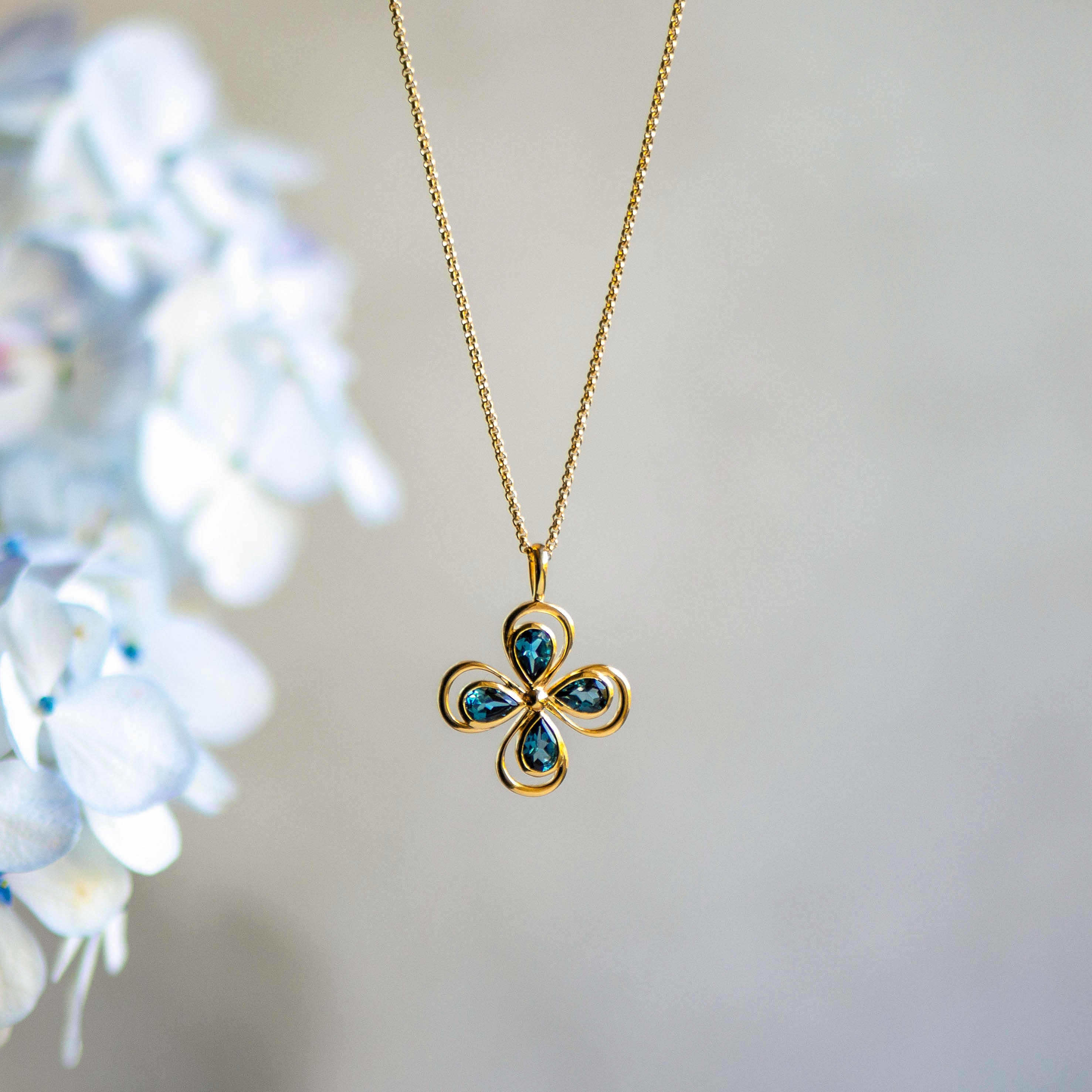 Lucky Clover Pendant in London Blue Topaz Paired With Lucky Drop Earrings